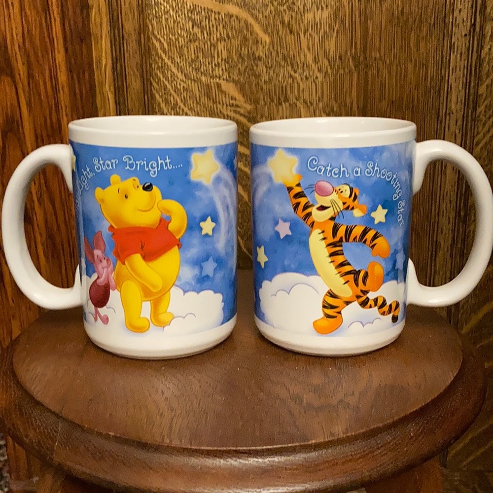 2 Vintage Winnie the Pooh mugs. Both say item 31736; but 1 is a smidge taller.